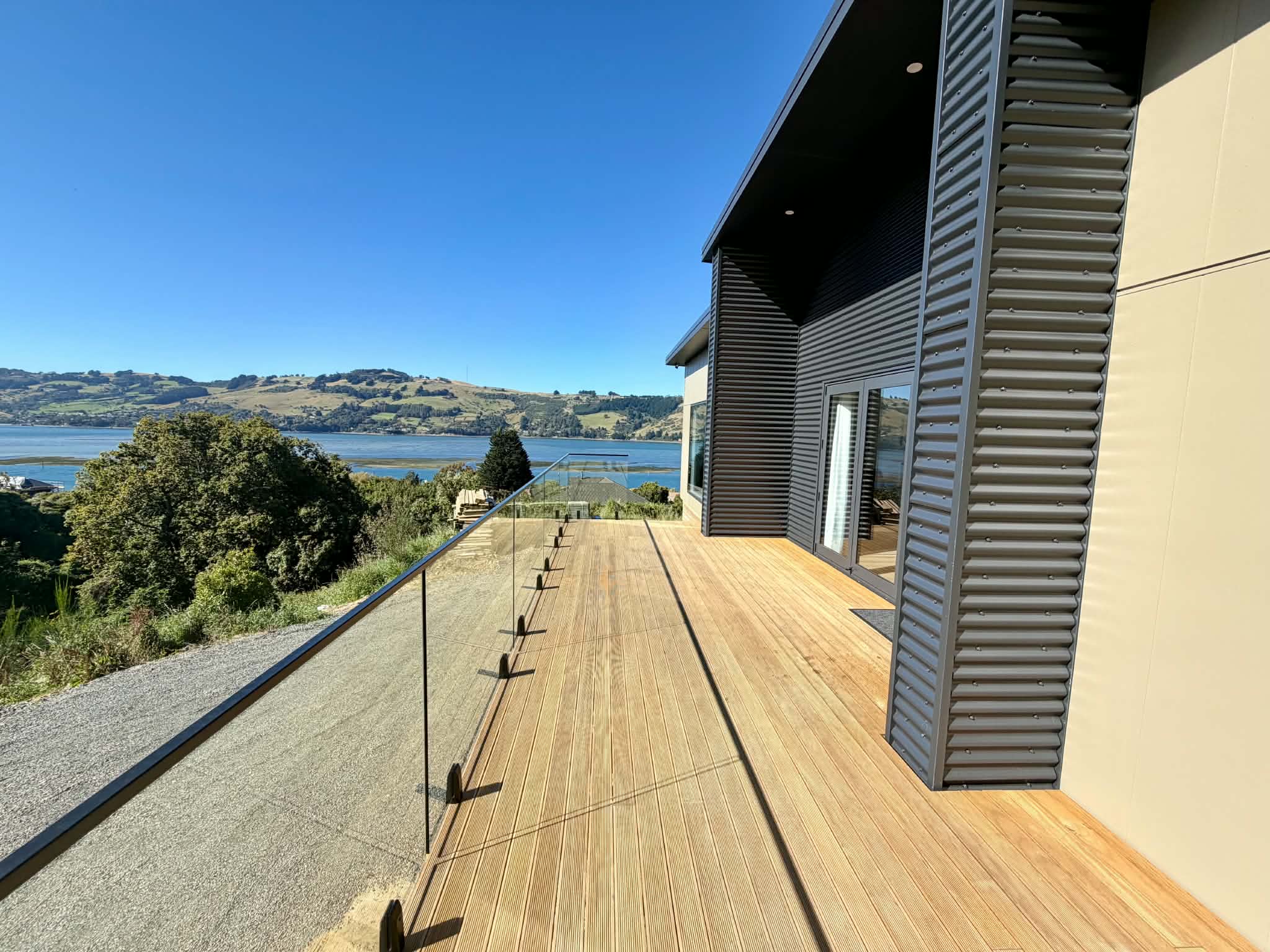 Large deck and expansive view across Otago Harbour